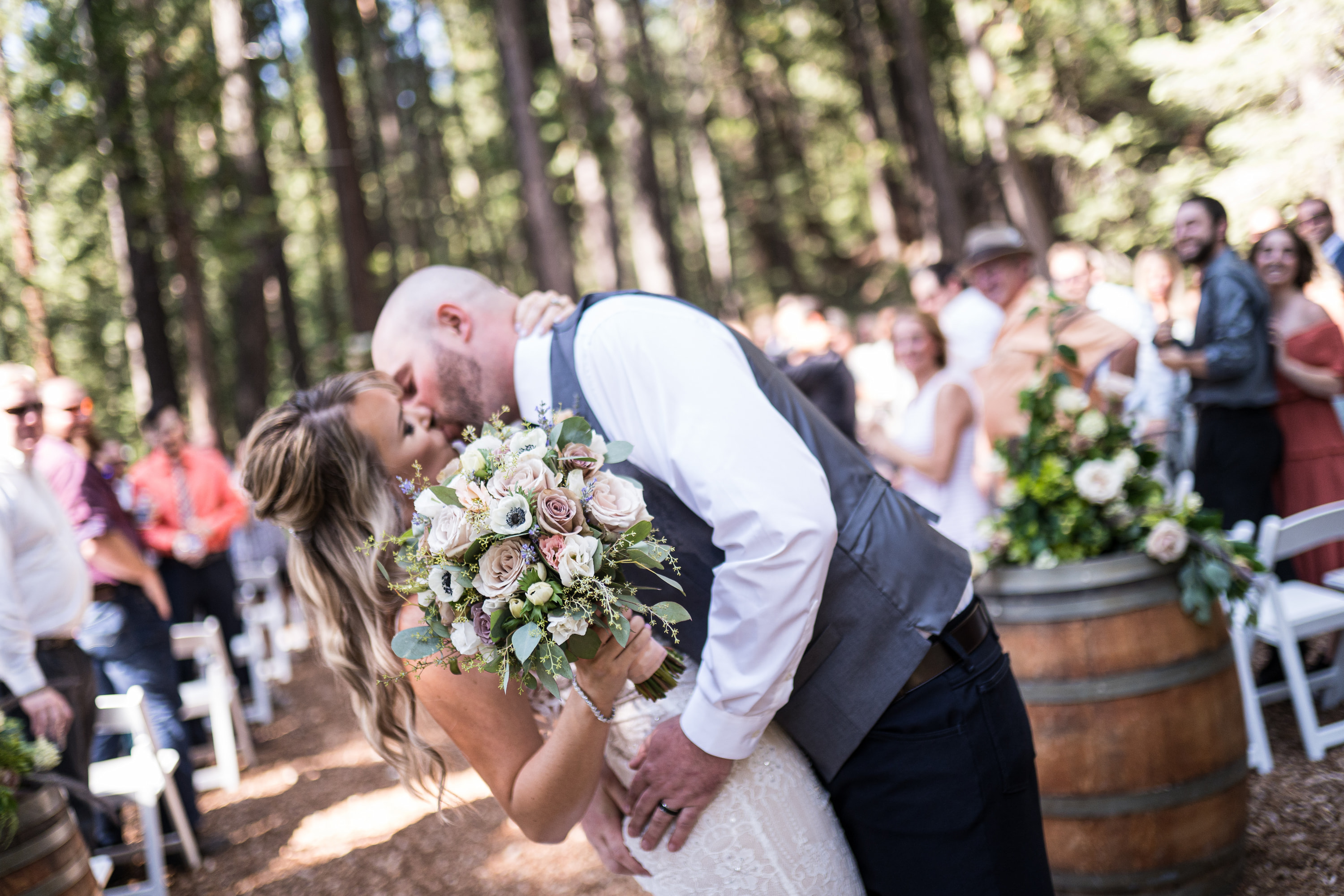 Coreen and Kellen's wedding ceremony first kiss - DJs In Reno Coreen and Kellen's first kiss as a married couple at their outdoor Reno wedding ceremony with DJ services by DJs In Reno