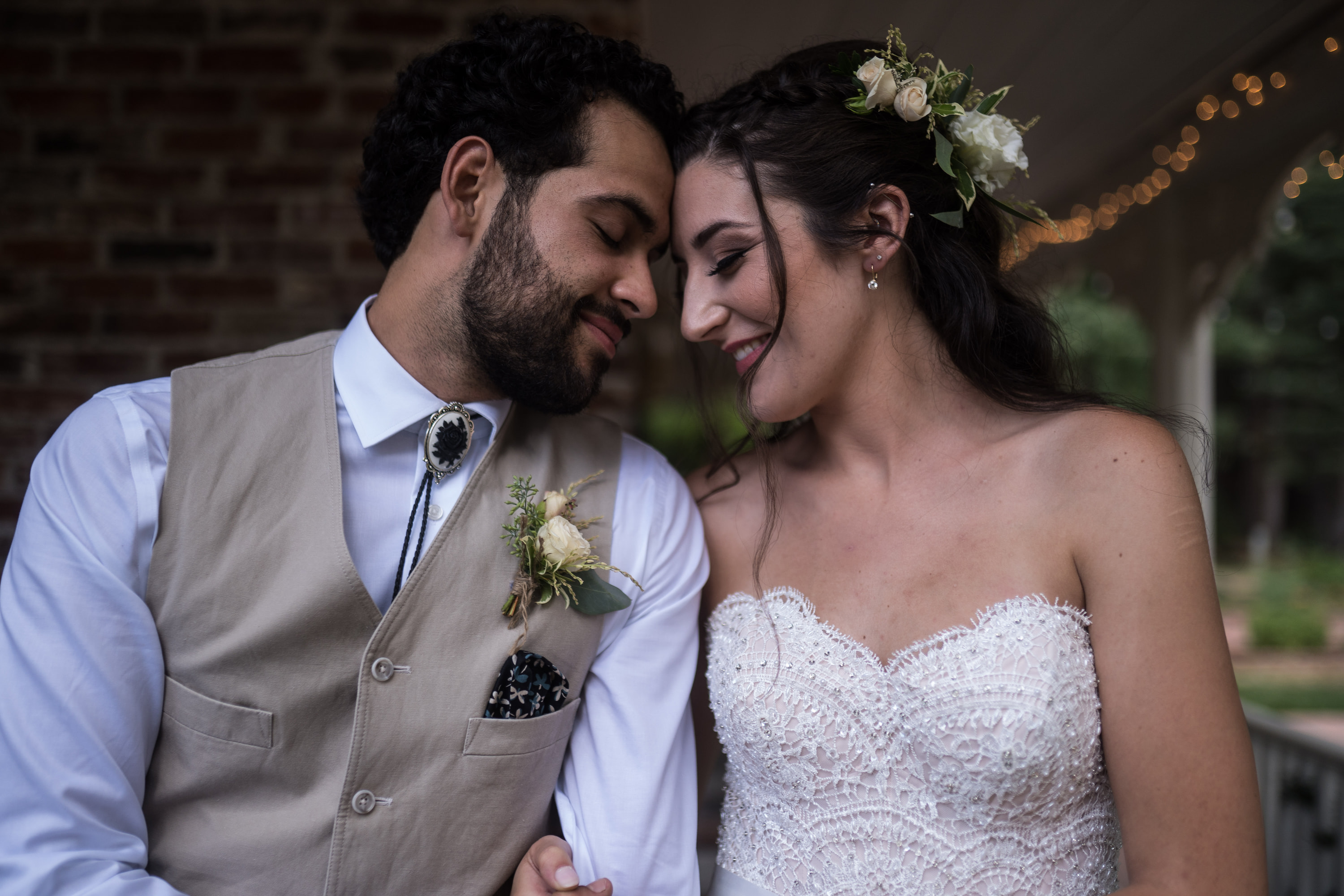 Shannon and Ryan Figueroa sharing an intimate embrace at their elegant Reno wedding reception with DJ services by DJs In Reno