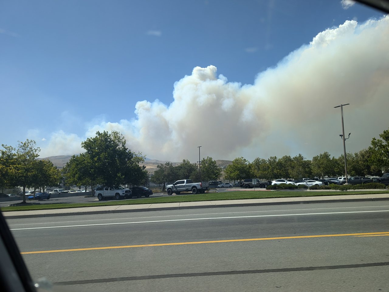 Smoke from the Hawk fire rising over the trees on the afternoon of the party