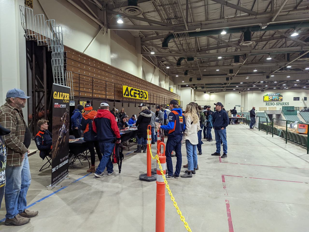 Fans at the team booths in the arena hall after the show