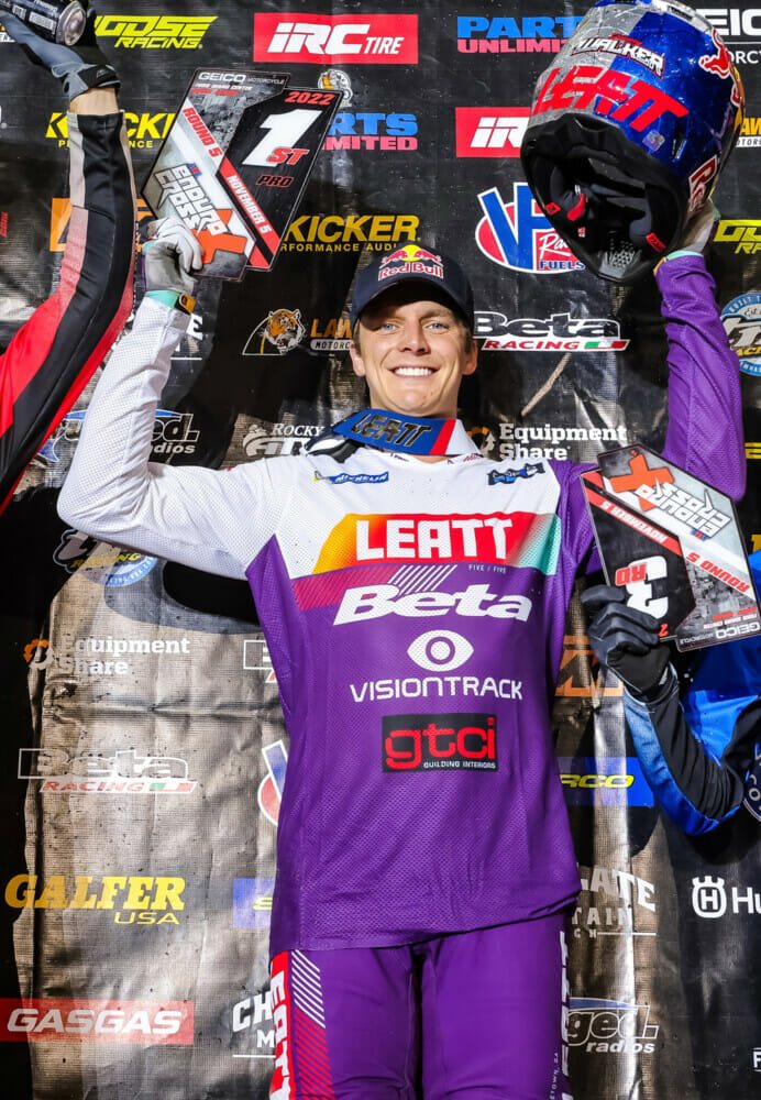 Jonny Walker holding up the number one plates on the Reno podium, photo from Cycle News