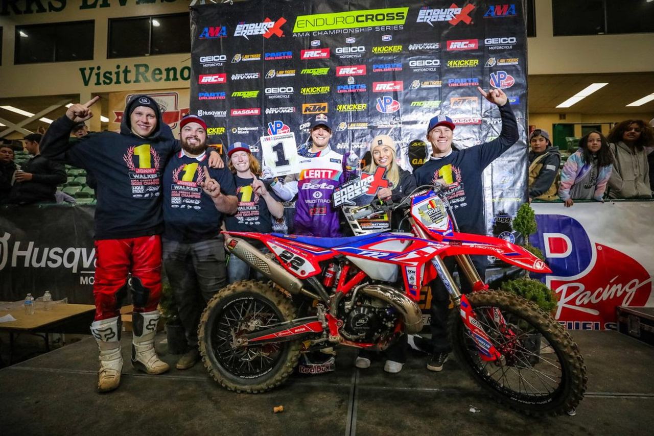 Jonny Walker and his team celebrating the title with the number one plate, photo from Racer X