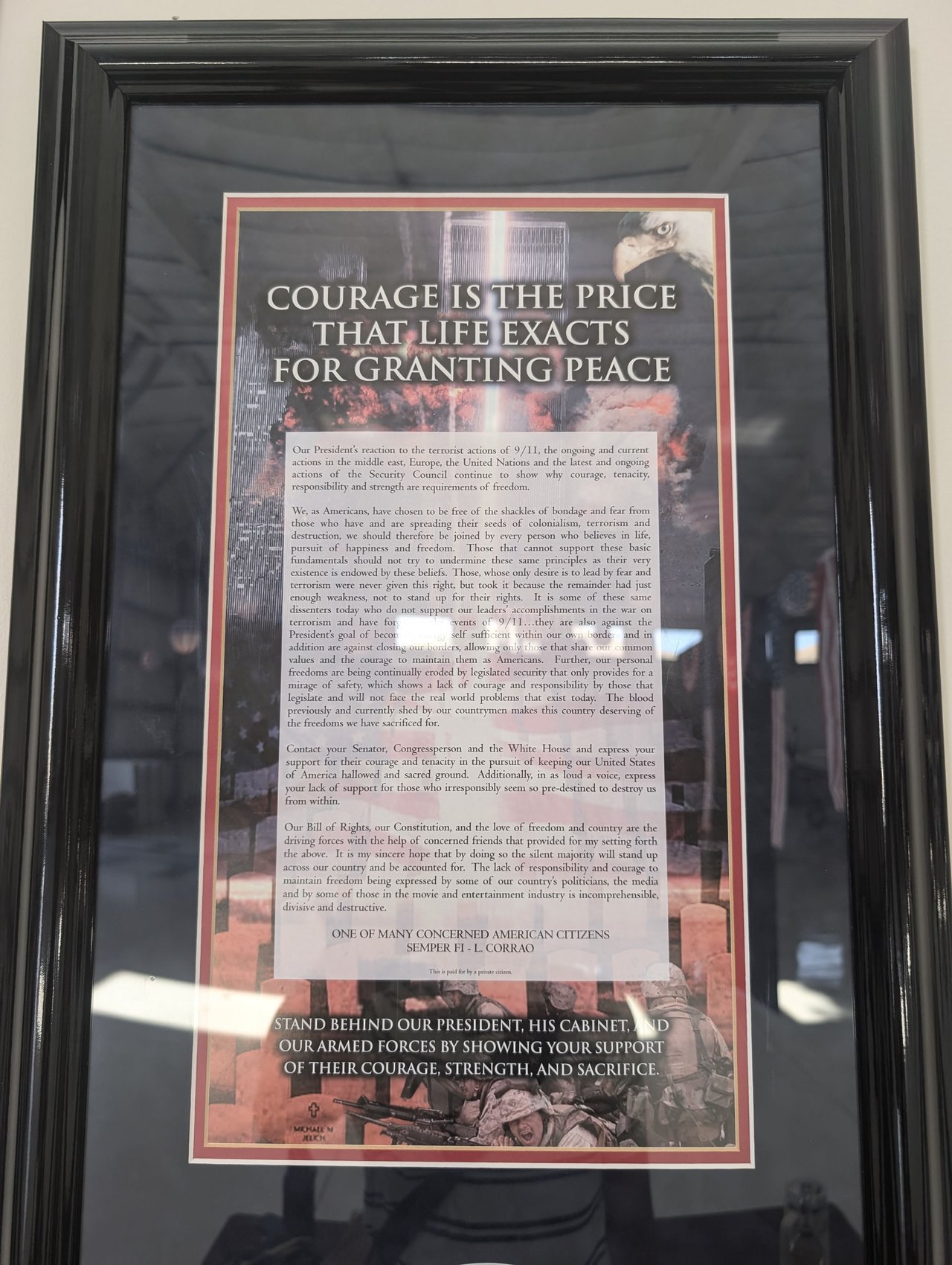 A framed poster reading Courage is the price that life exacts for granting peace