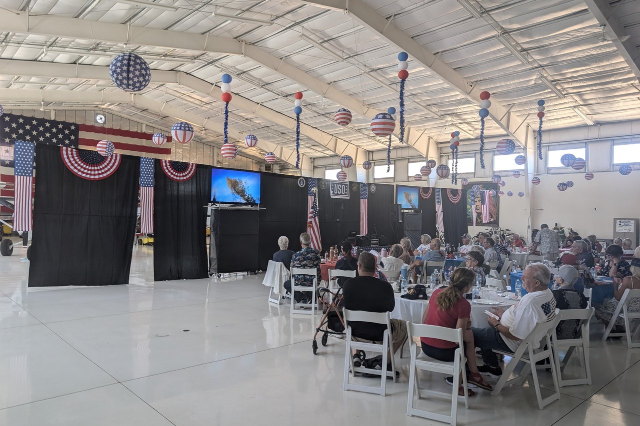 Guests watching the film on the screens by the USO stage