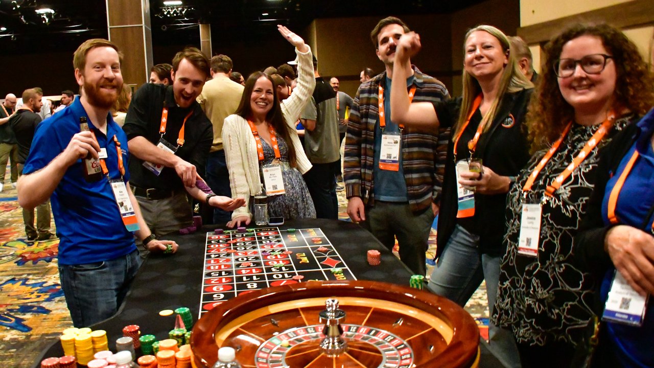AMUG guests cheering at the roulette wheel