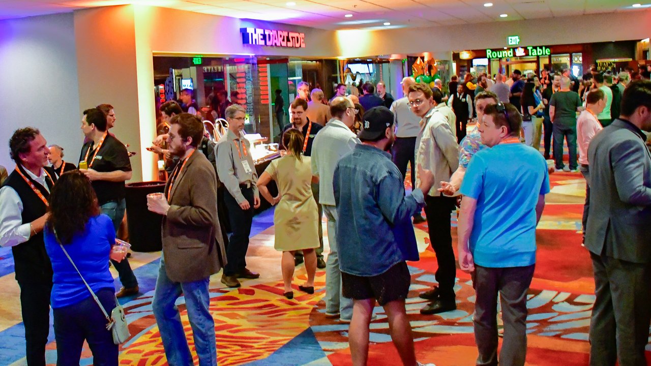 AMUG guests mingling on the casino carpet during the Game On night