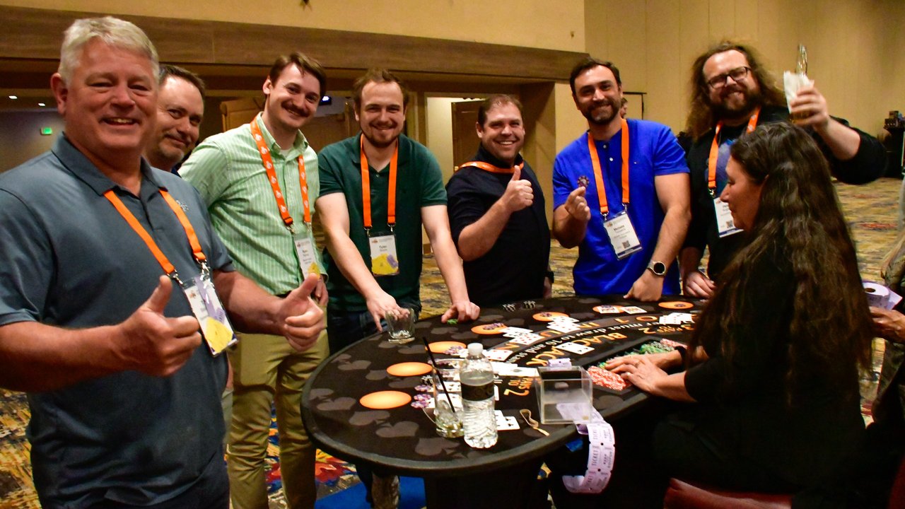 AMUG guests giving thumbs up around the blackjack table