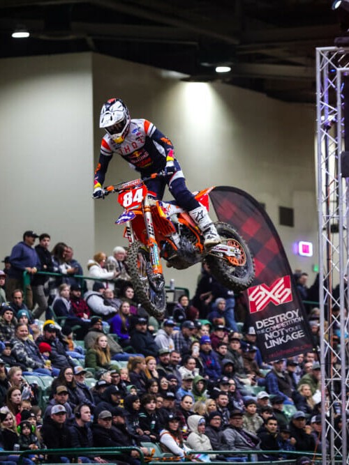 Trystan Hart in the air over the packed stands at AMA EnduroCross Reno, photo by Jack Jaxson for Cycle News