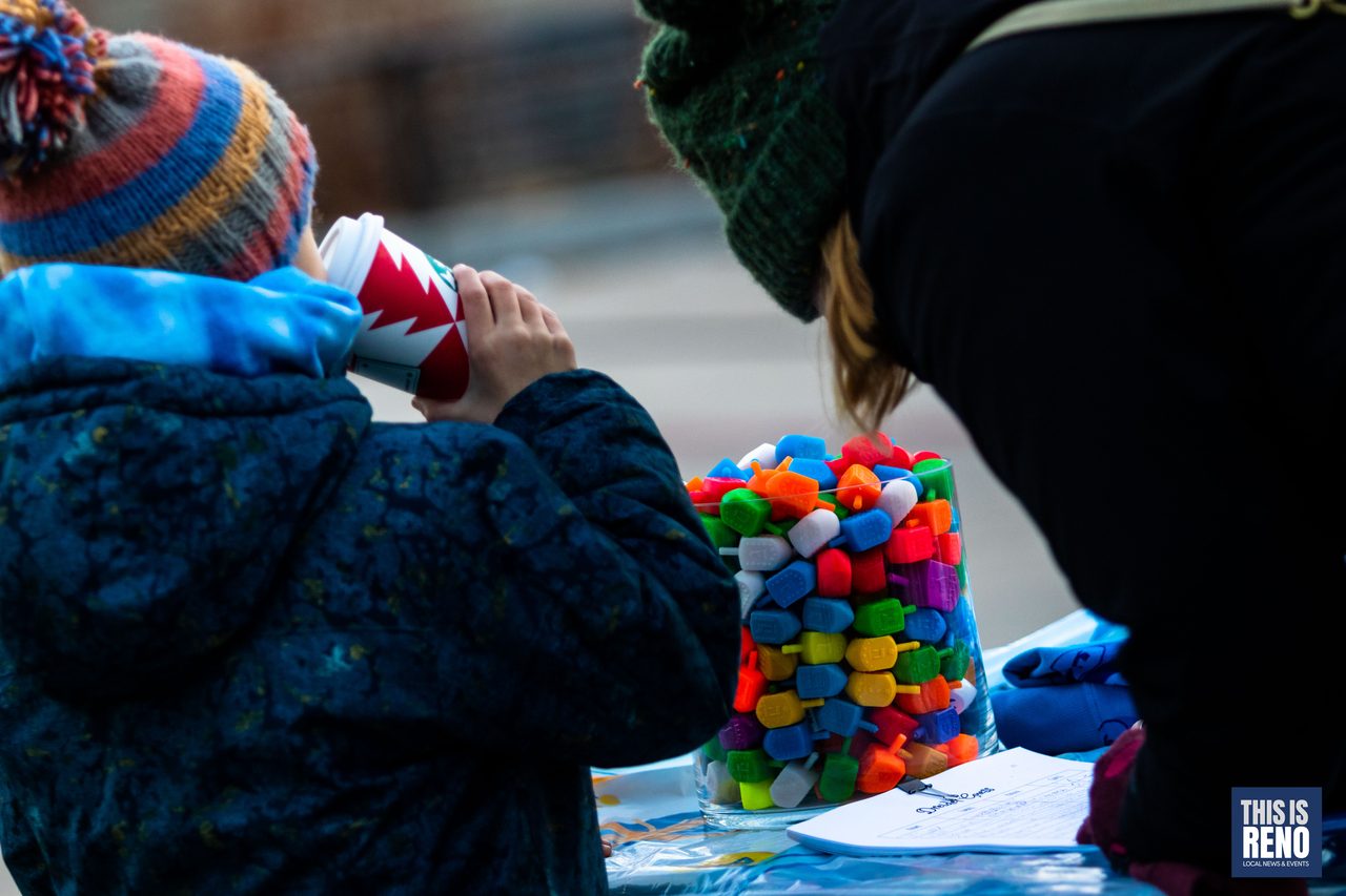A child having a treat at the candy table