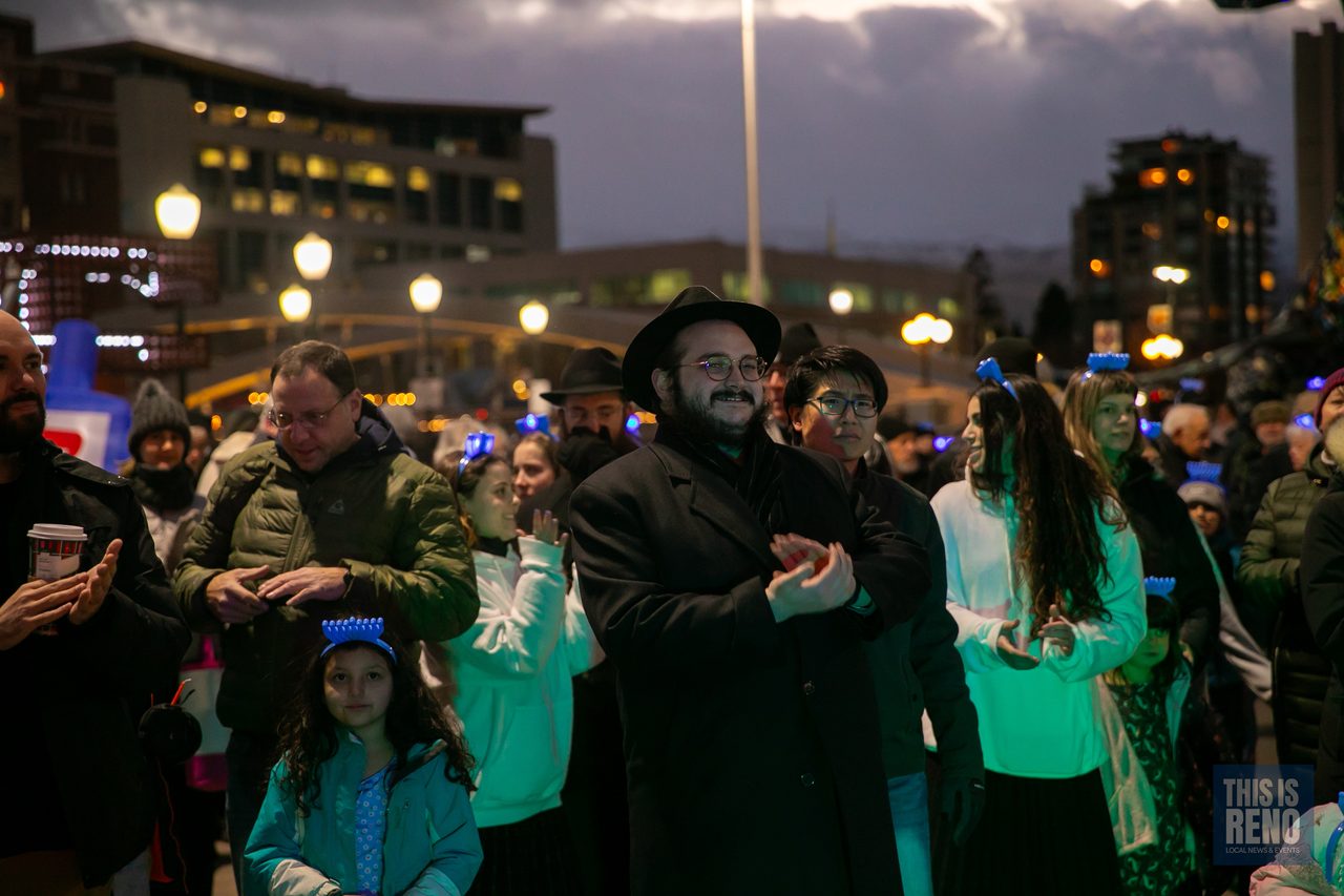 The crowd under the evening lights of City Plaza