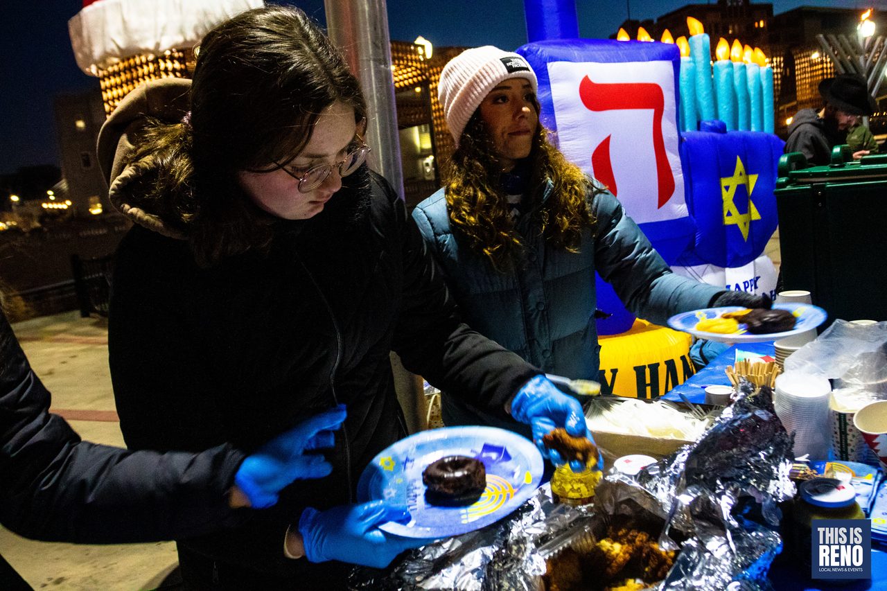 Volunteers serving latkes and donuts