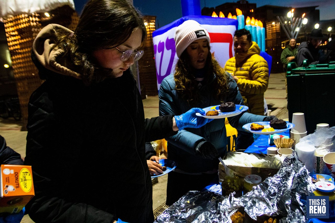 Latkes and donuts handed out at the food table