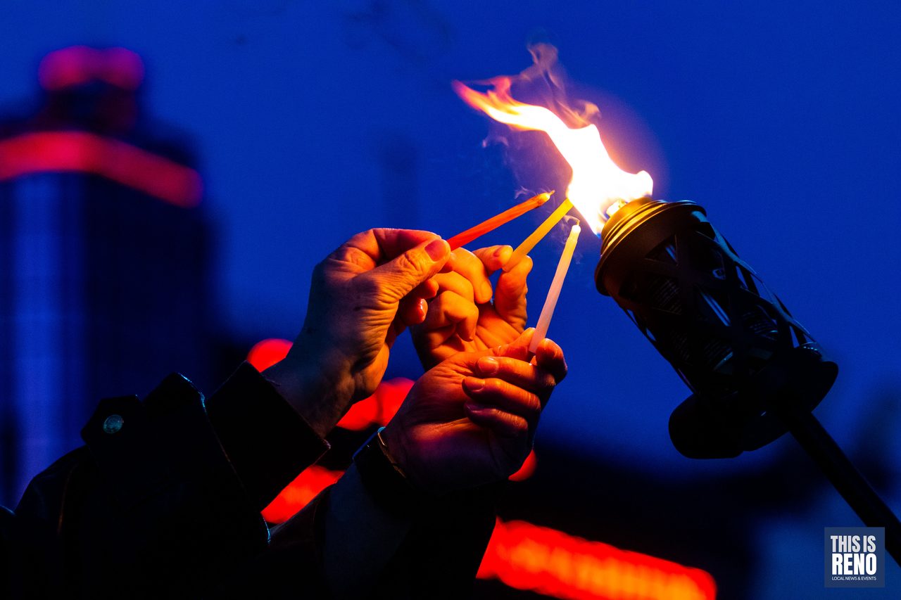 Lighting the torch for the first candle