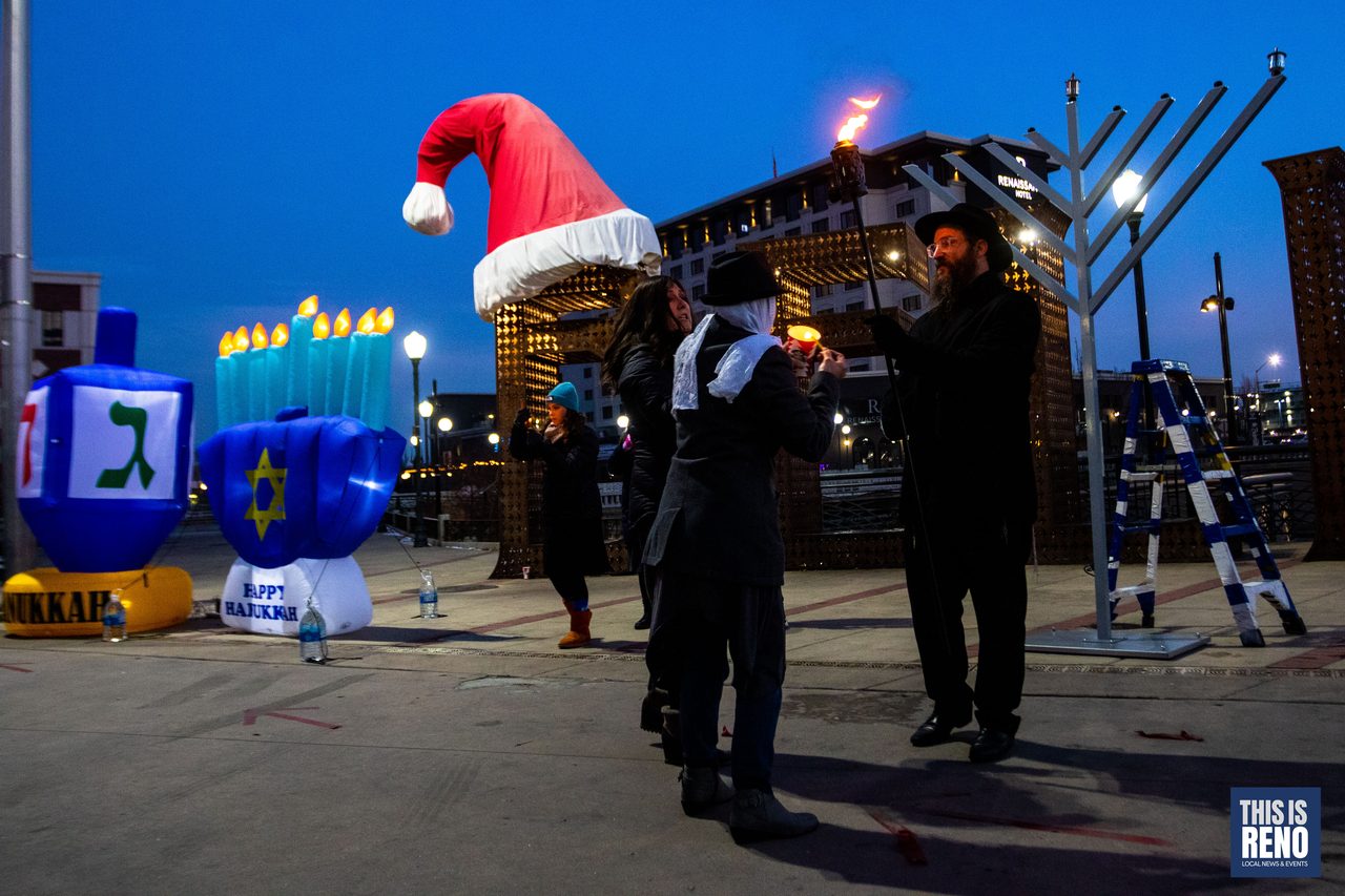 The menorah, the dreidels and a Santa hat at dusk
