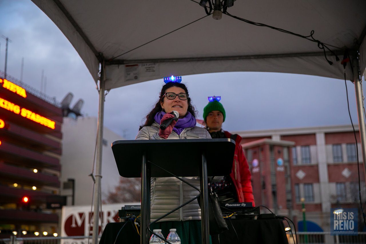 A speaker reads her remarks at the podium