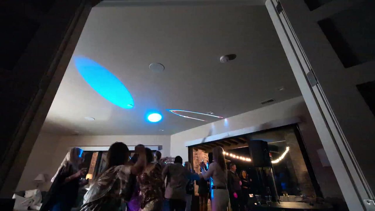 The dance floor under blue and white lights late in the night