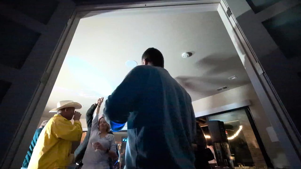Guests dancing right in front of the DJ booth