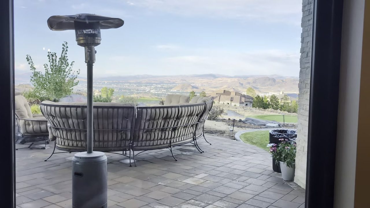 The patio sectional and heater with the valley view behind the house before guests arrived