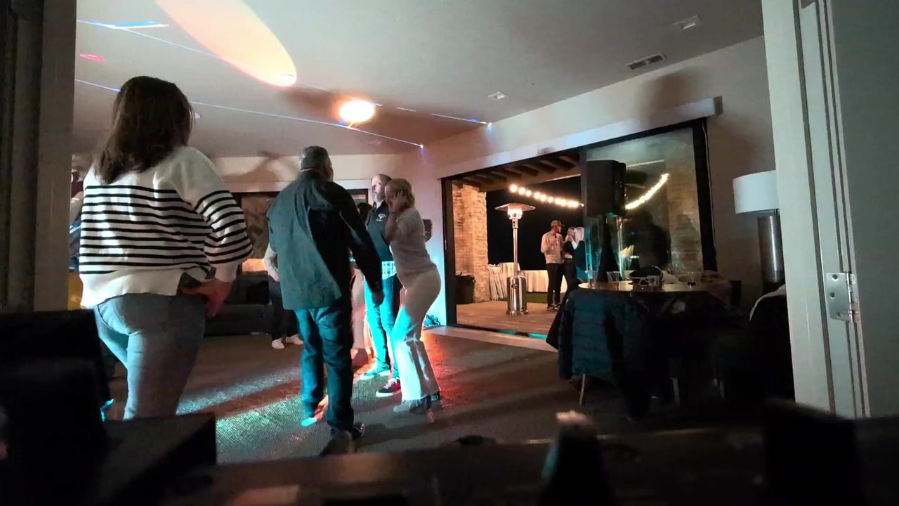 Guests still dancing in the living room as the night went on
