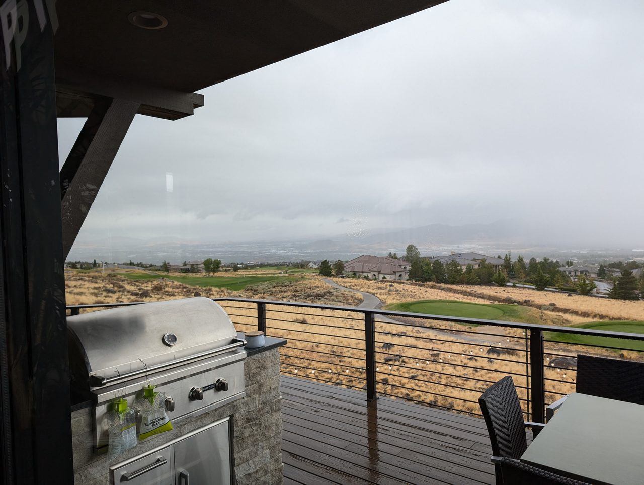 The covered patio and grill looking out over the ArrowCreek golf course and the Reno valley