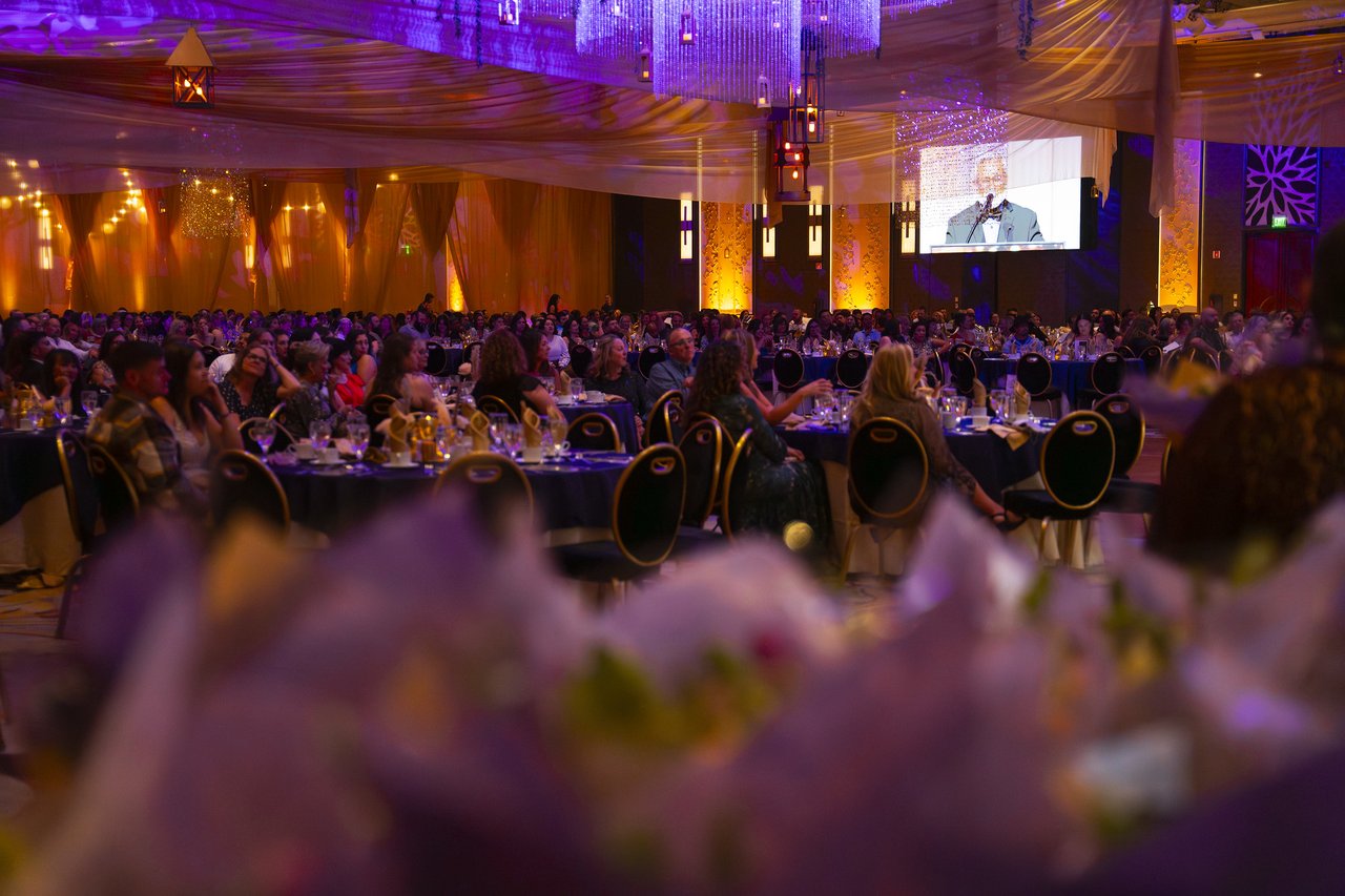 The full ballroom seen through the flowers