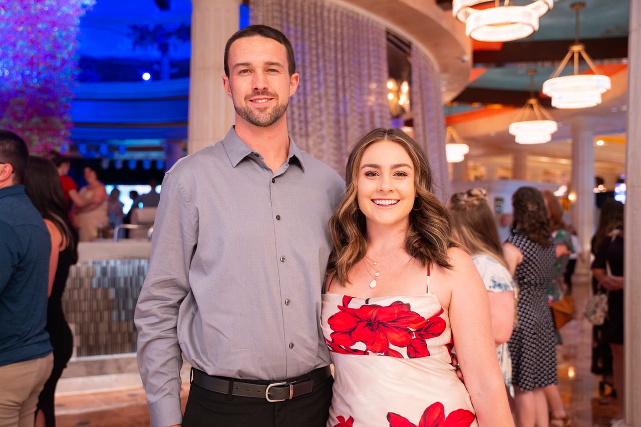 A Renown couple smiling in the Peppermill as they arrive for the night
