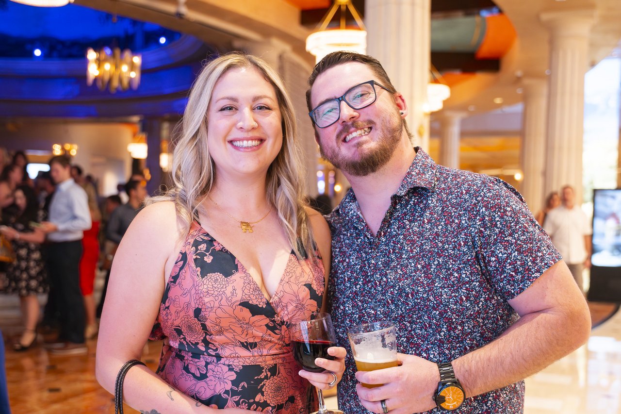 A Renown couple grinning together in the casino lobby
