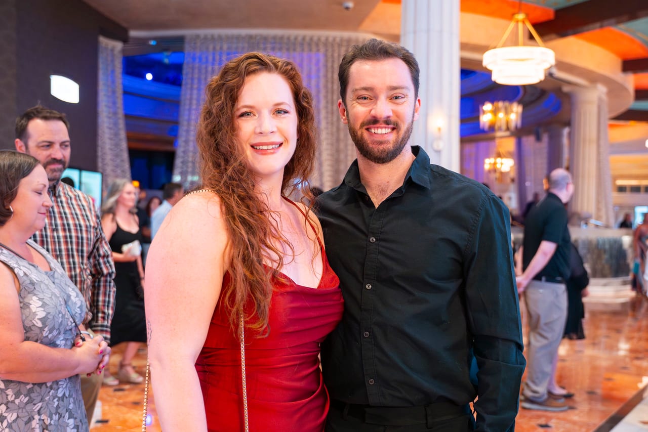 A Renown couple smiling in the Peppermill lobby before the doors opened