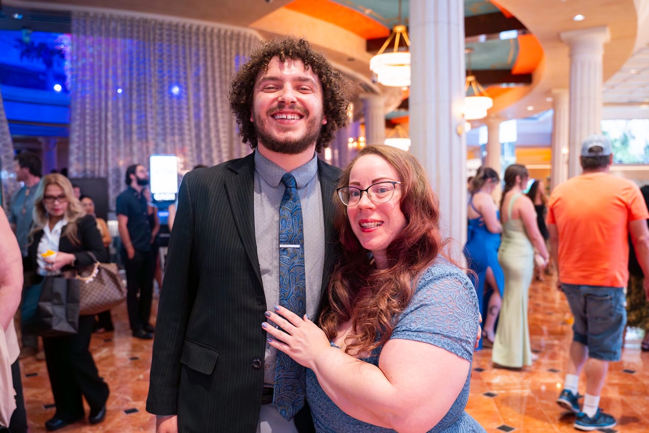 A Renown couple laughing together in the Peppermill lobby