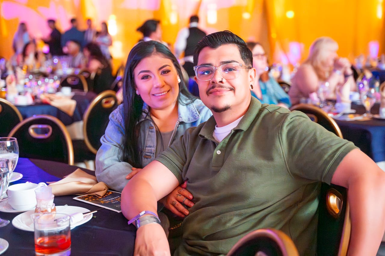 A Renown couple relaxing together at their dinner table