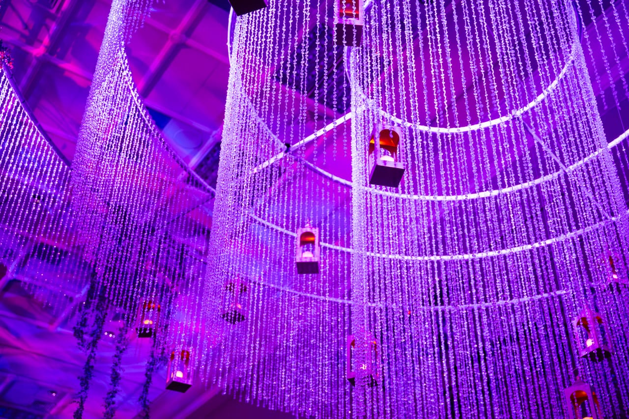 Strands of crystals and hanging lanterns inside the giant chandelier