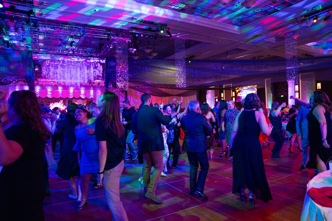 The dance floor full of Renown guests under the moving lights