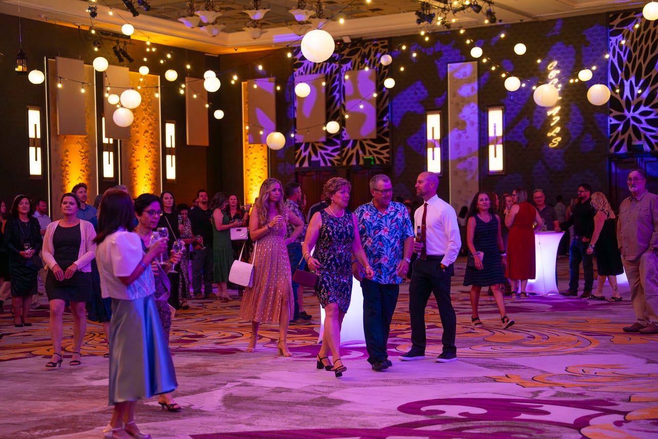 Renown guests arriving under the globe lights and string lights