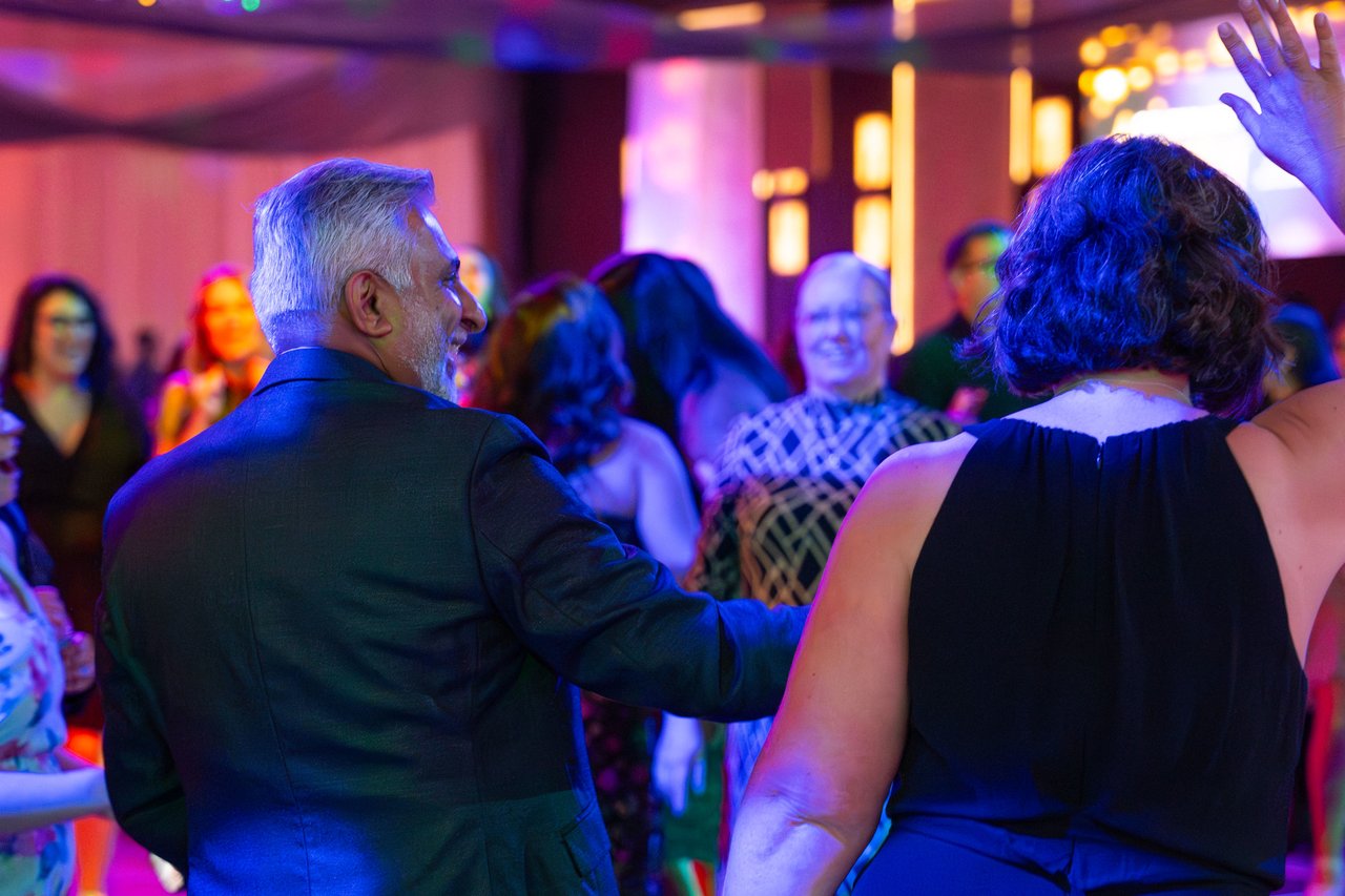 Renown guests dancing together on the dance floor