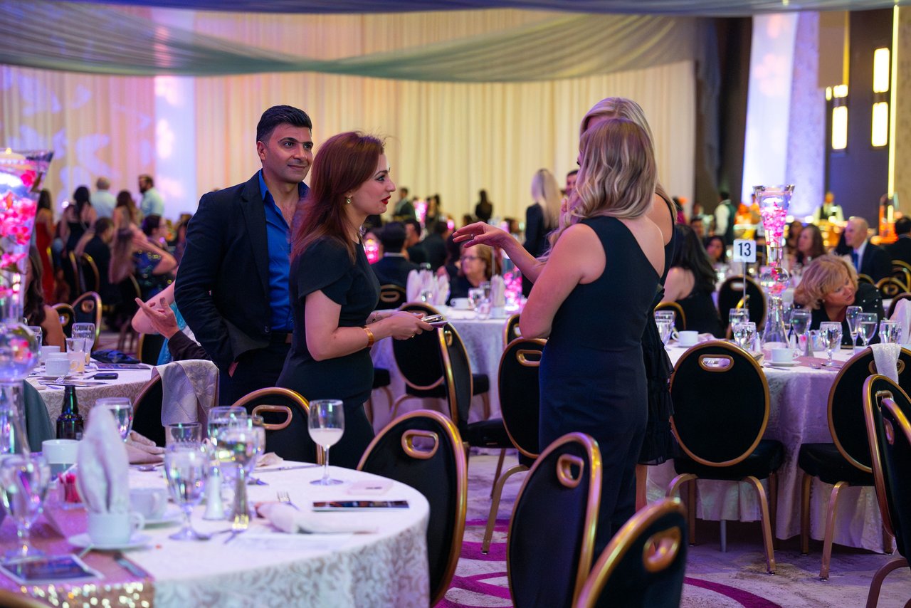 Renown guests finding their seats at the dinner tables