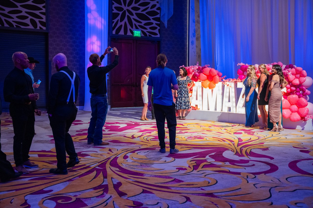 Renown guests taking photos at the Amazing letters and balloon wall