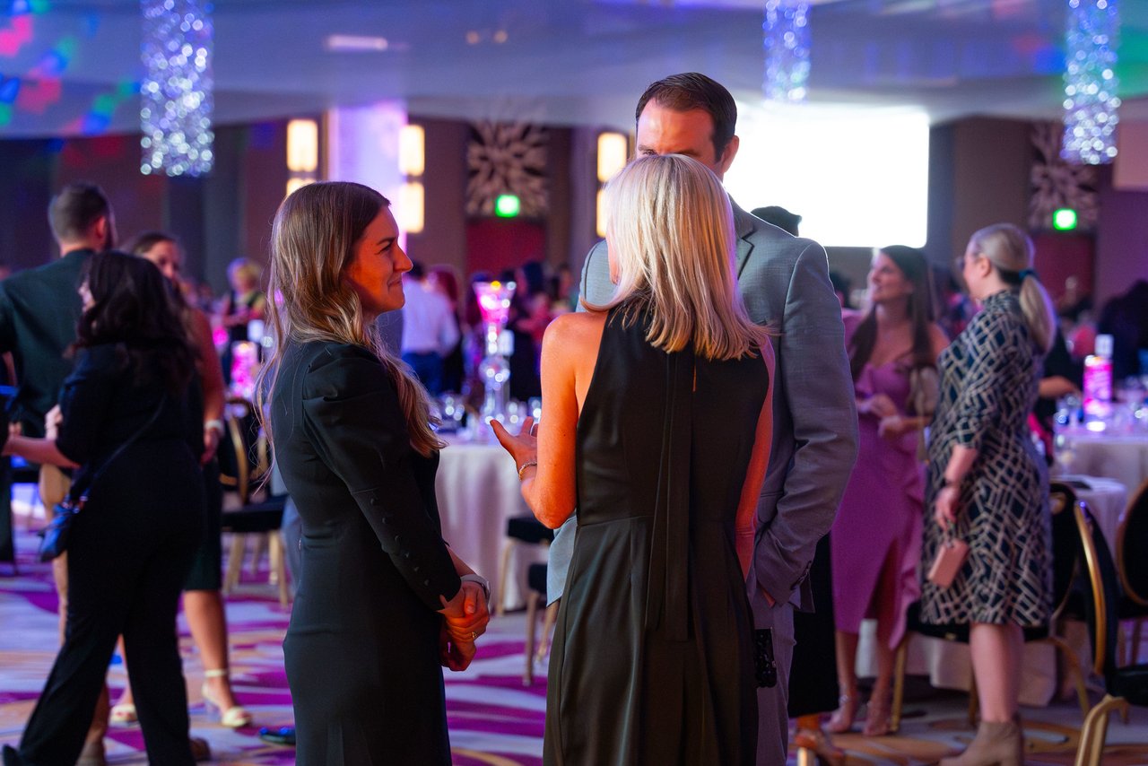 Renown guests mingling in the ballroom before dinner
