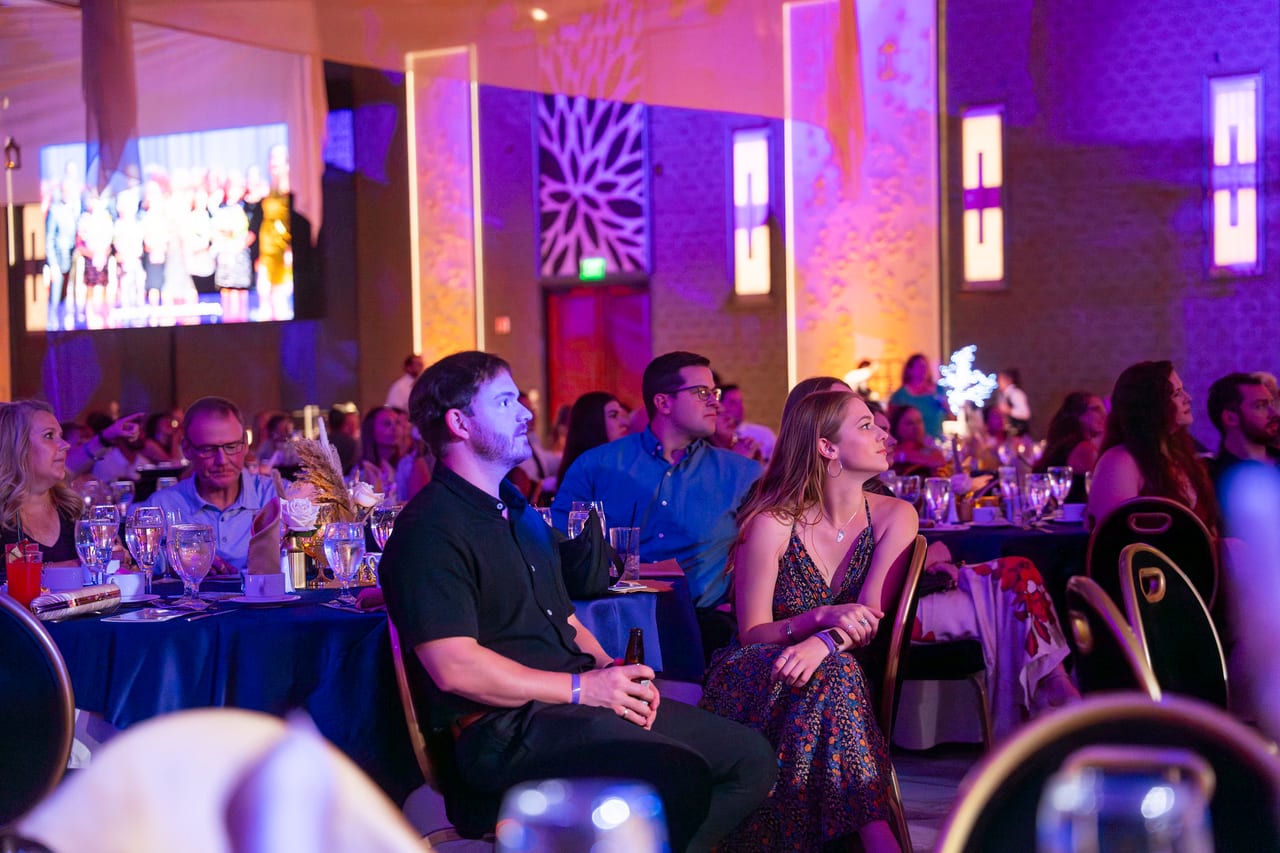 Renown guests watching the program from their tables