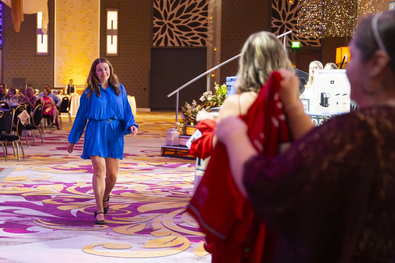 A Renown honoree walking past the raffle prize table