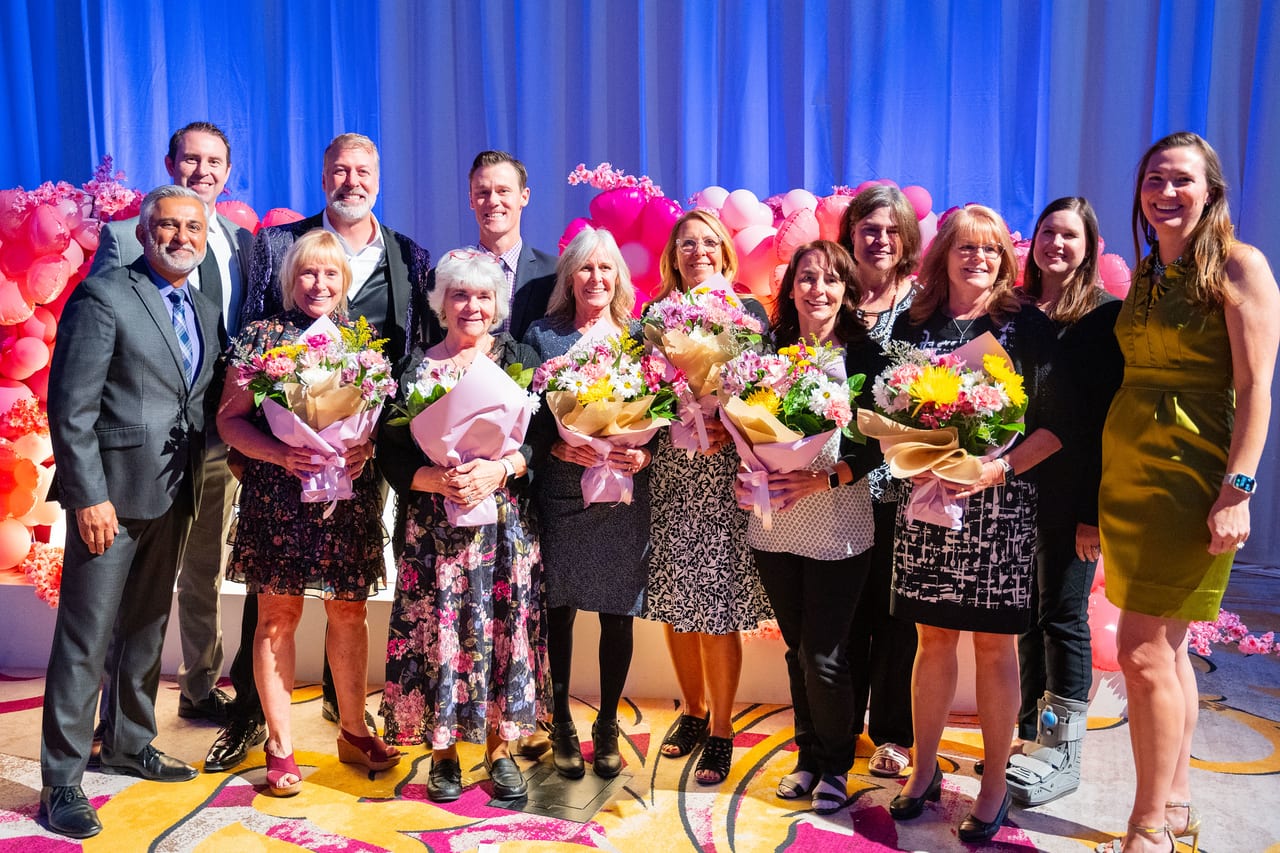 Renown honorees holding their bouquets with the leaders who honored them