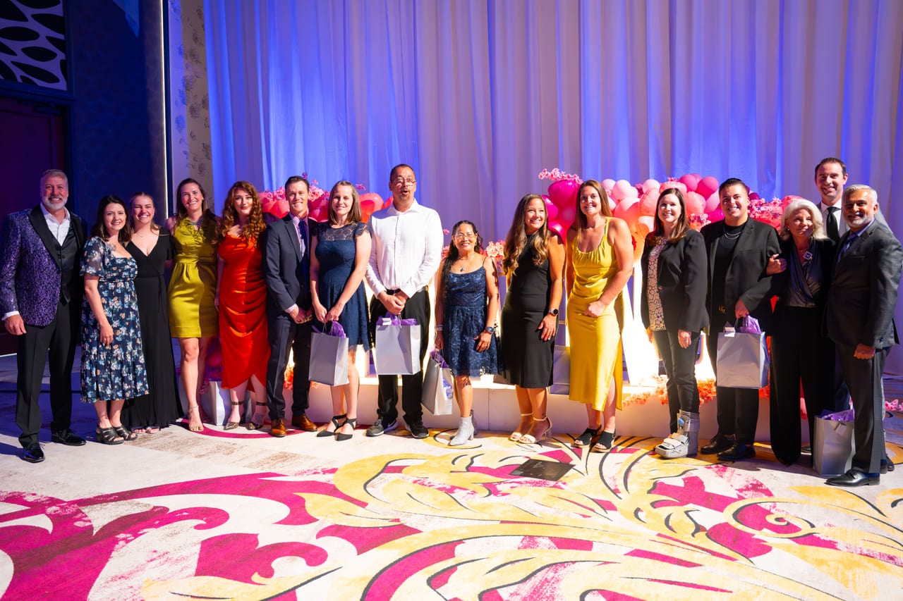 Renown honorees lined up together in front of the balloon wall