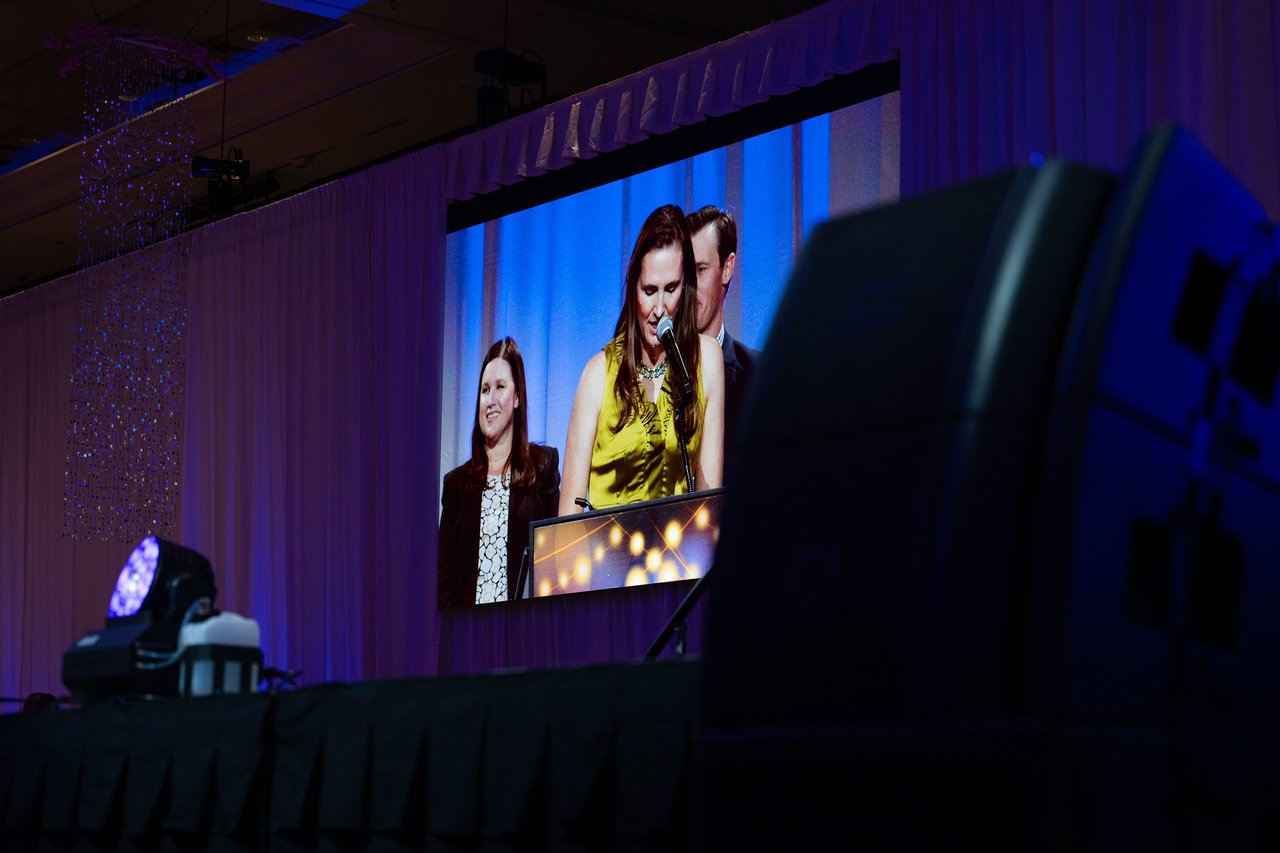 The big screen showing Renown honorees on stage