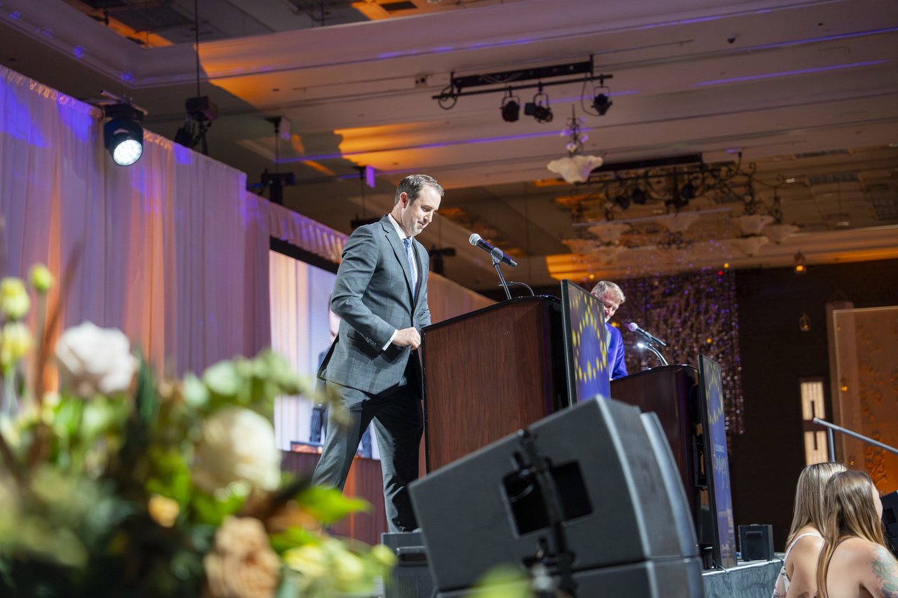 A Renown leader walking up to the podium