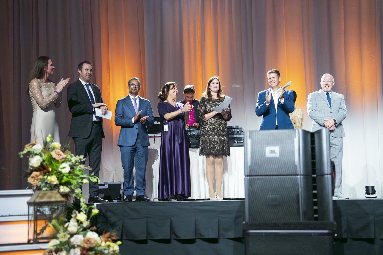 Renown leaders cheering for the honorees on stage