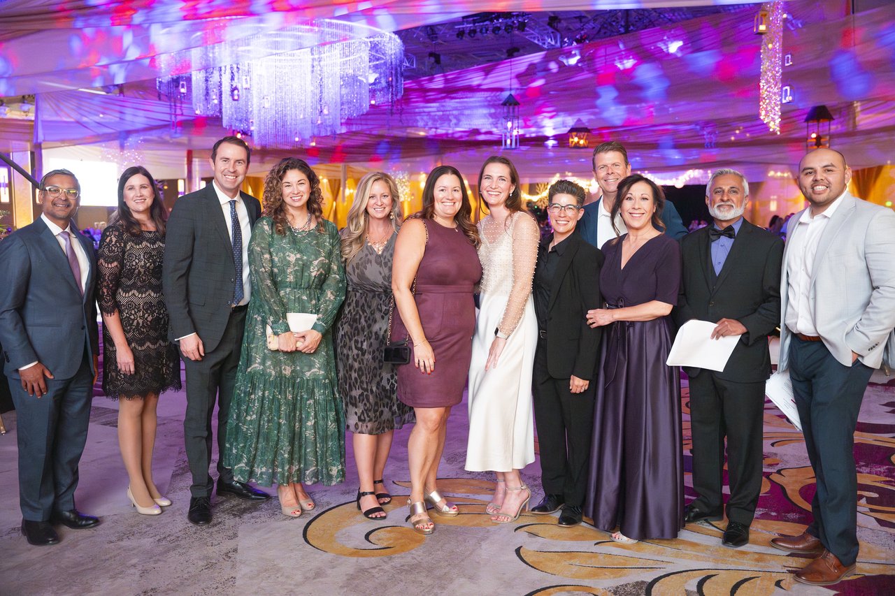 The Renown leadership team posing together on the dance floor