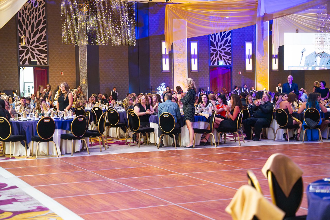 The packed ballroom seen across the empty dance floor