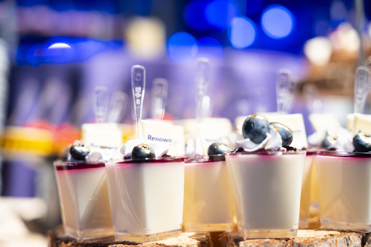 A close up of Renown panna cotta cups topped with blueberries