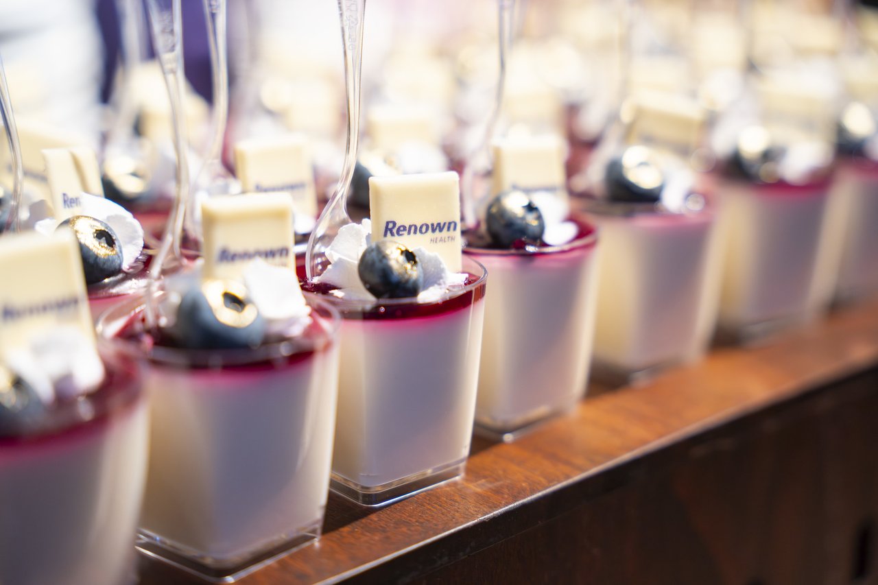 Renown panna cotta cups with berry sauce and blueberries