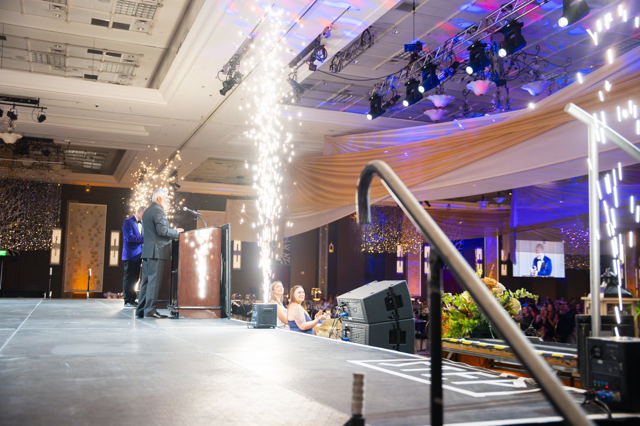 Cold spark fountains firing beside the podium