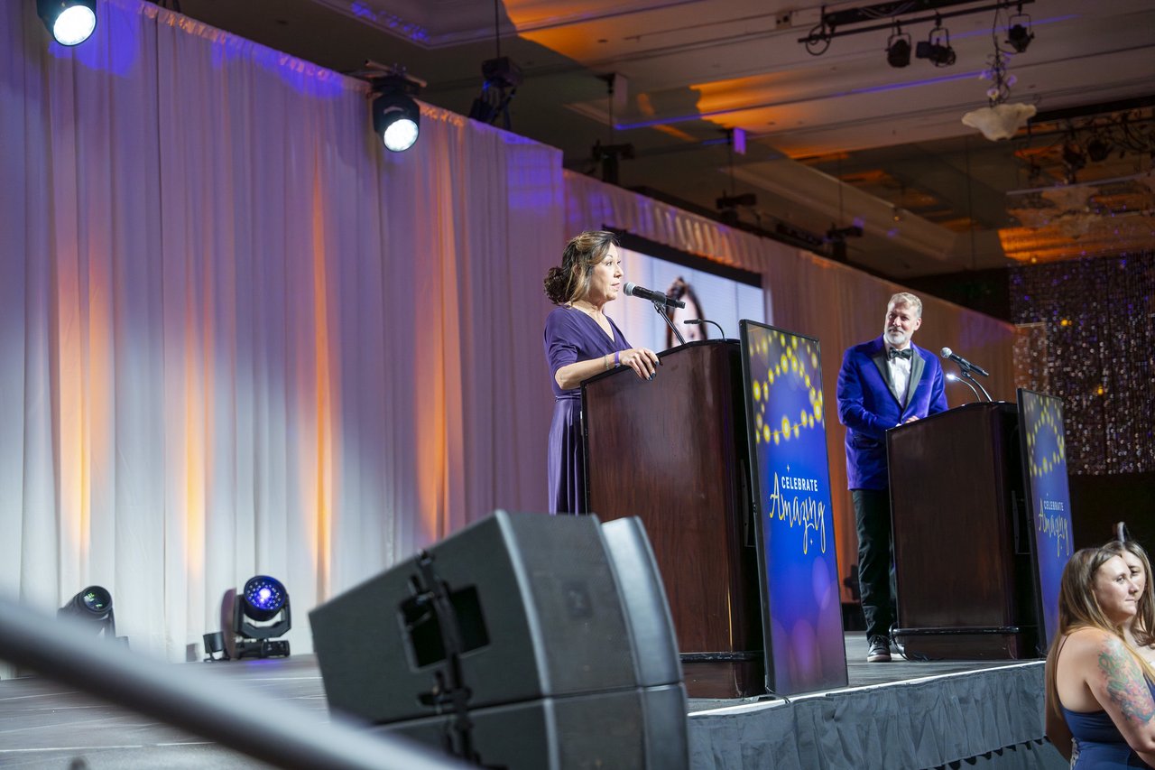 A Renown leader and the host speaking from the stage